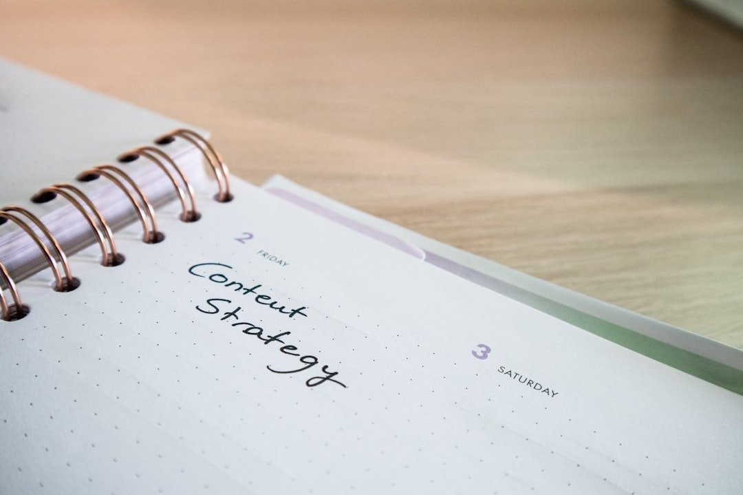 Content creator planning an Instagram strategy in a notebook