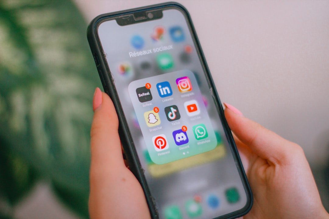 Person looking overwhelmed scrolling through social media on a smartphone
