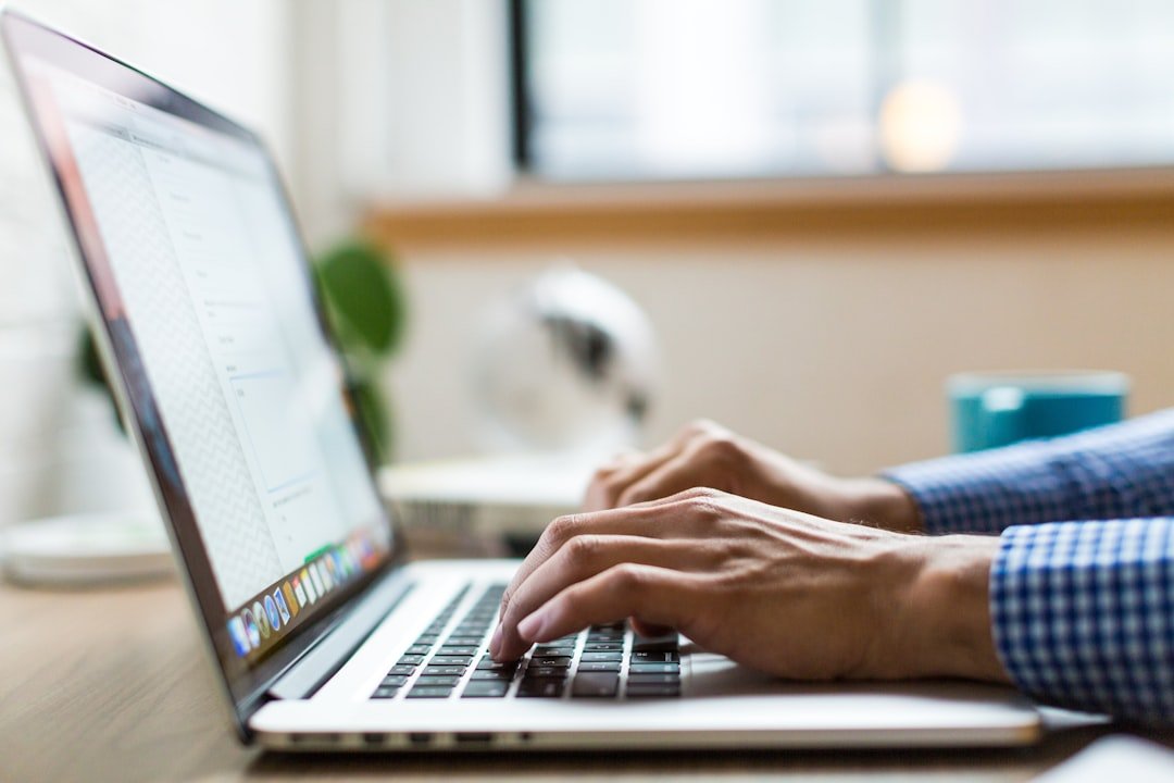Person completing an online business application on a laptop for an EIN number