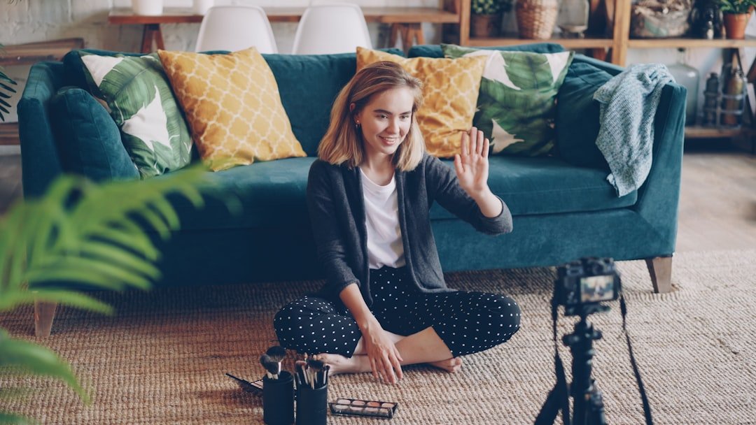 Content creator filming a video in a home studio setup for Instagram growth strategy