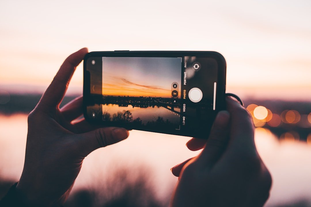 Creator filming a TikTok or YouTube Shorts video on a smartphone