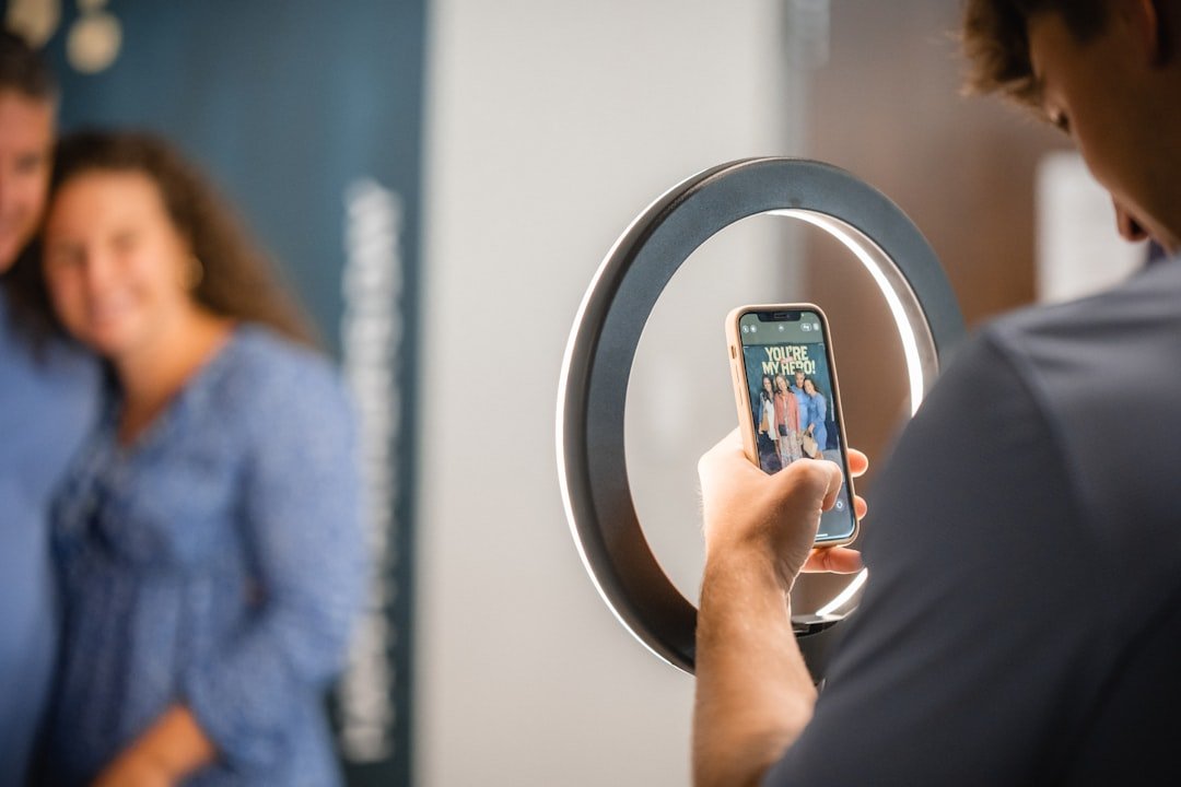Content creator recording a short-form video at a desk with ring light setup
