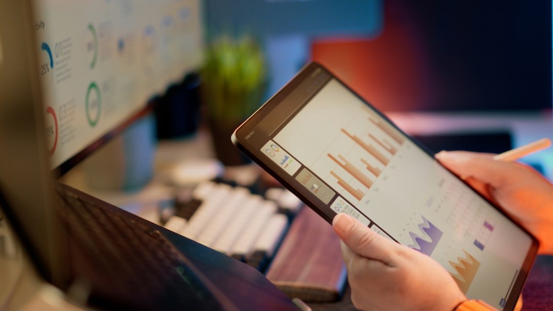 Person managing multiple social media accounts on several screens