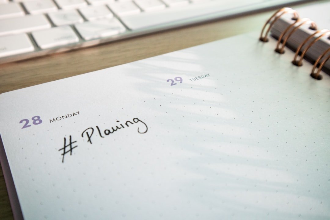 Content calendar and planning tools laid out on a desk with a laptop